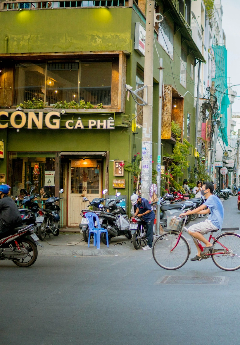 Cộng Cà Phê corner with bicycle and motorbikes, central Saigon